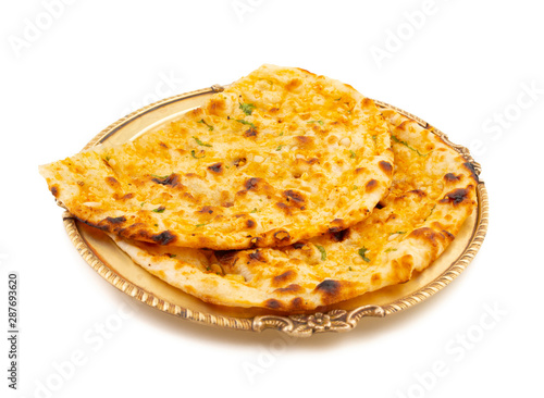Indian Healthy Cuisine Garlic Bread Also Know as Garlic Naan, Coriander Naan, Indian Flat bread or Garlic Nan Served in a Plate on Isolated on White Background