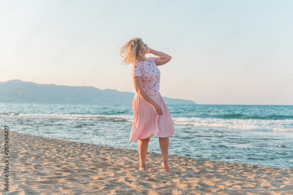 Plus size woman in holidays, Picturesque view of the beach, Location:  Beach, Greece. Vacations and adventure concept  