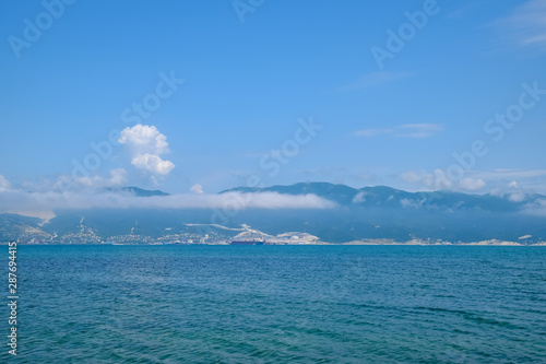 Seascape of the cement bay  Sea and mountains near