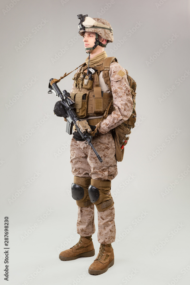United states Marine Corps special operations command raider with weapon. Studio shot United states Marine Corps special operations command raider with weapon. Studio shot