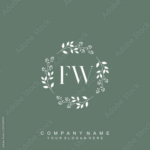 letter FW surrounded by beautiful and elegant flowers and leaves. Wedding monogram logo template. Fashion Logo template Vectors,