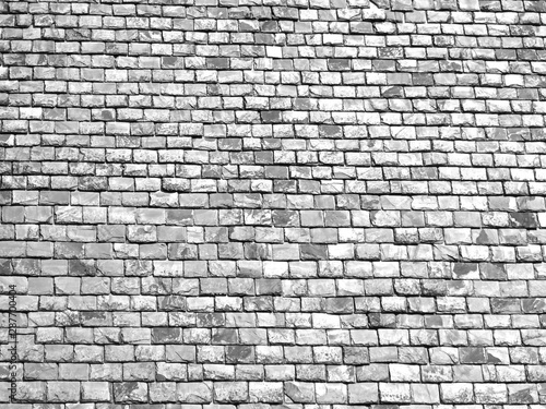 Bnw old tiles roofs with gray color variations on a utility roof. Some textures and shades of the material viewable on this old slate roof. Slate material with angle view in a 4x3 photography