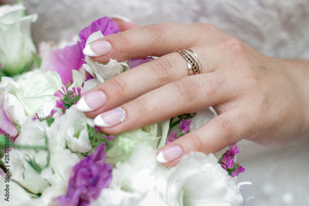 Fototapeta premium Beautiful wedding bouquet in hands of the bride