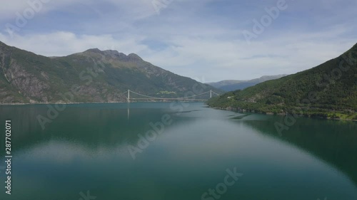 The Hardanger Bridge is a suspension bridge across the Eidfjorden branch of Hardangerfjorden in Hordaland county, Norway. photo