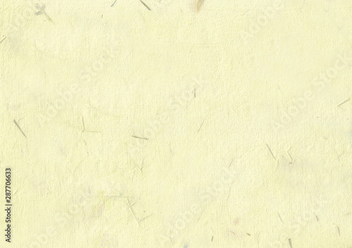yellow korean traditional paper mixed with dried petals and leaves