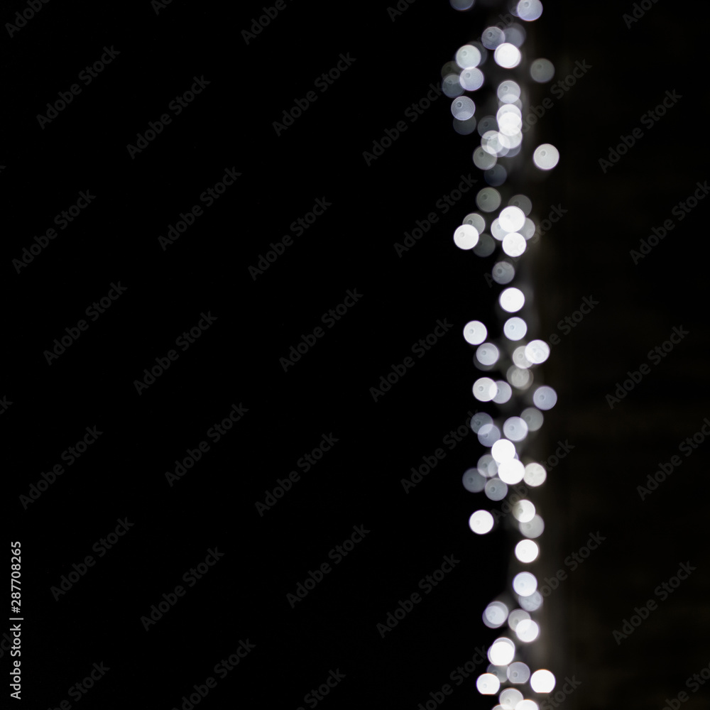 Abstract bokeh blurred glowing light on black surface backdrop Abstract bokeh blurred glowing light on black surface backdrop