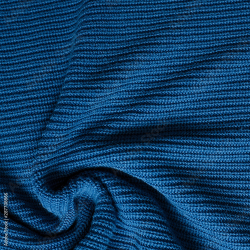 Prussian blue knitted twisted fabric, texture background