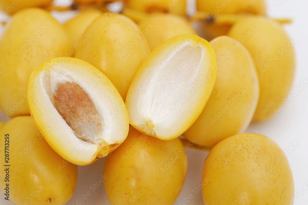 Raw date palm sweet fruit isolated on white background. This has clipping path. Raw date palm sweet fruit isolated on white background. This has clipping path.