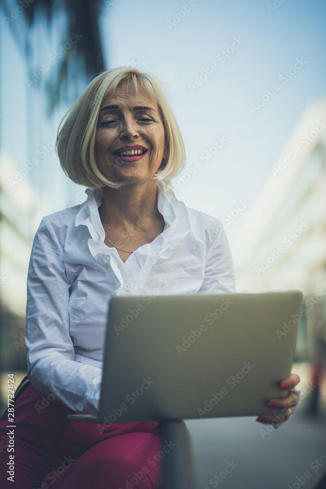 Getting her work done with a smile.