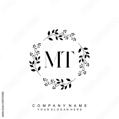 letter MT surrounded by beautiful and elegant flowers and leaves. Wedding monogram logo template. Fashion Logo template Vectors,