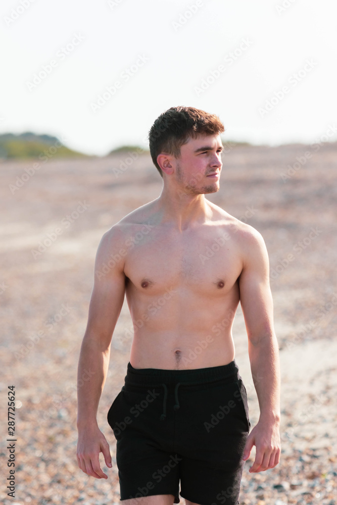 Shirtless on a beach Shirtless on a beach