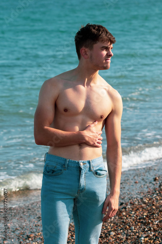 Shirtless on a beach