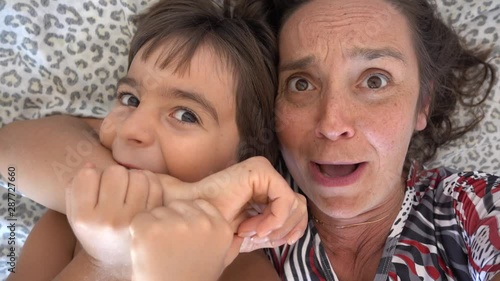 4K Selfie - Funny mother and son play cannibals, crystal child photo