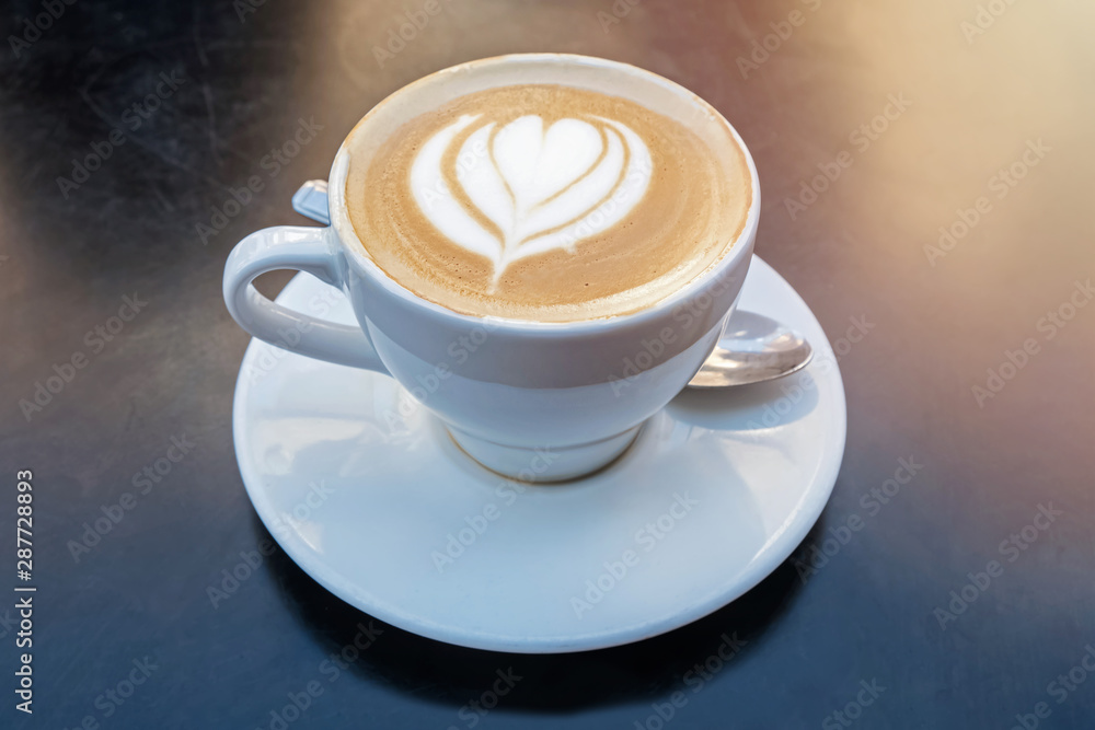 Fresh cappuchino or flat white coffee with latte art close-up Fresh cappuchino or flat white coffee with latte art close-up
