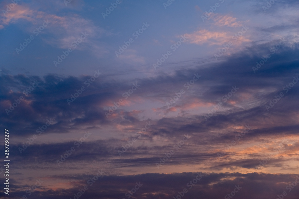 Multicolor Dramatic sky with dark clouds formations, sunset scene