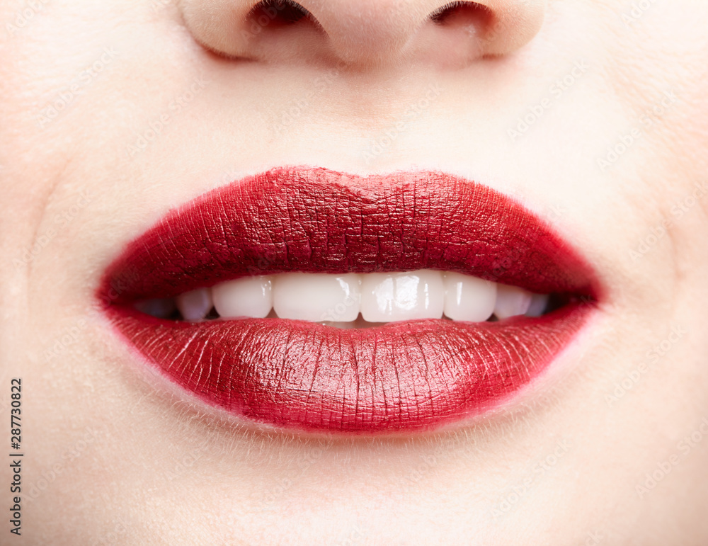 Closeup macro portrait of female red smiling lips with day beauty makeup. Closeup macro portrait of female red smiling lips with day beauty makeup.