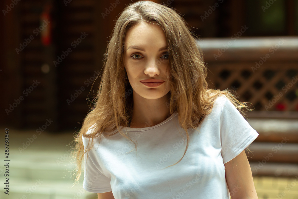 street portrait of beautiful young brunette girl