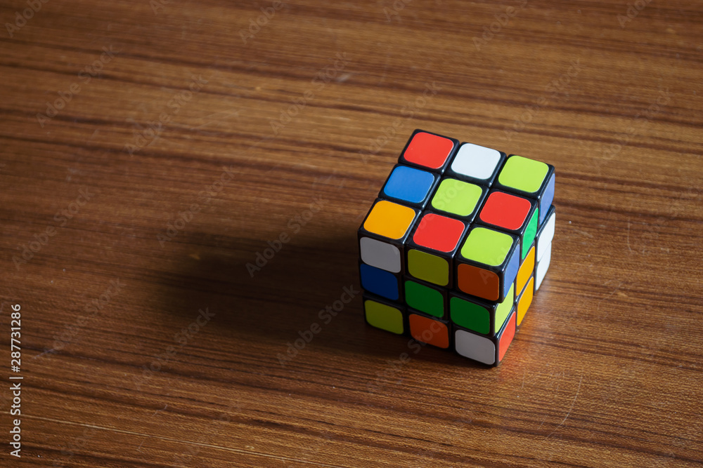 Bangkok, Thailand - June 10, 2019 : Rubik's cube on wooden table. Photos |  Adobe Stock