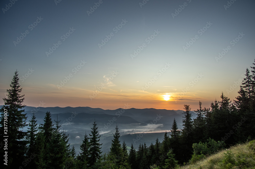 Obraz premium Misty summer morning in the mountains