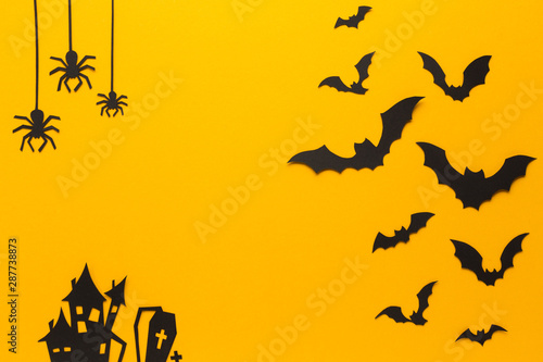 Halloween spiders and bats with orange background