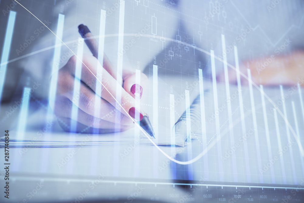Double exposure of woman's hands making notes with forex graph hologram. Concept stock market analysis. Double exposure of woman's hands making notes with forex graph hologram. Concept stock market analysis.