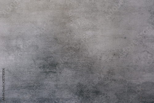 Background of a gray stucco coated and painted exterior, rough cast of cement and concrete wall texture
