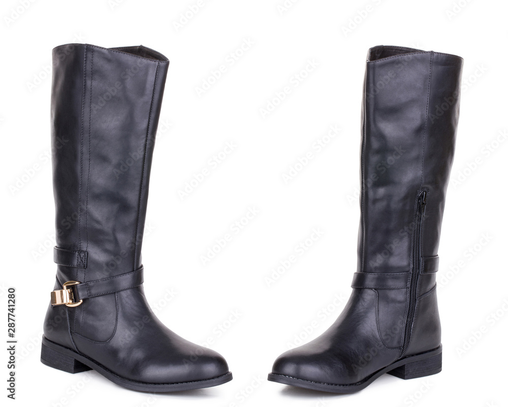 Classic black glossy leather high knee flat heels female boots. Two isolated Classic black glossy leather high knee flat heels female boots. Two isolated