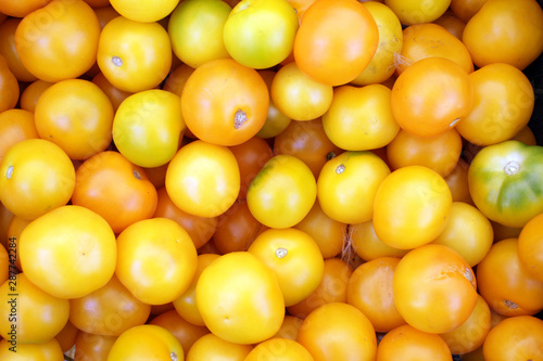 Yellow tomatoes. Full frame. Yellow pattern.