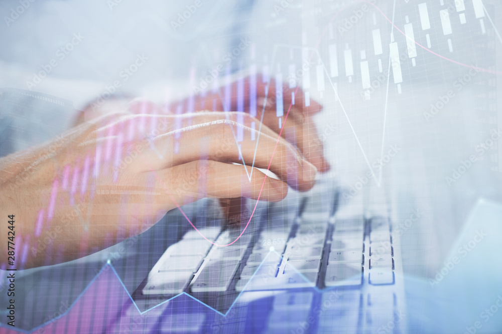 Multi exposure of graph with man typing on computer in office on background. Concept of hard work. Closeup. Multi exposure of graph with man typing on computer in office on background. Concept of hard work. Closeup.