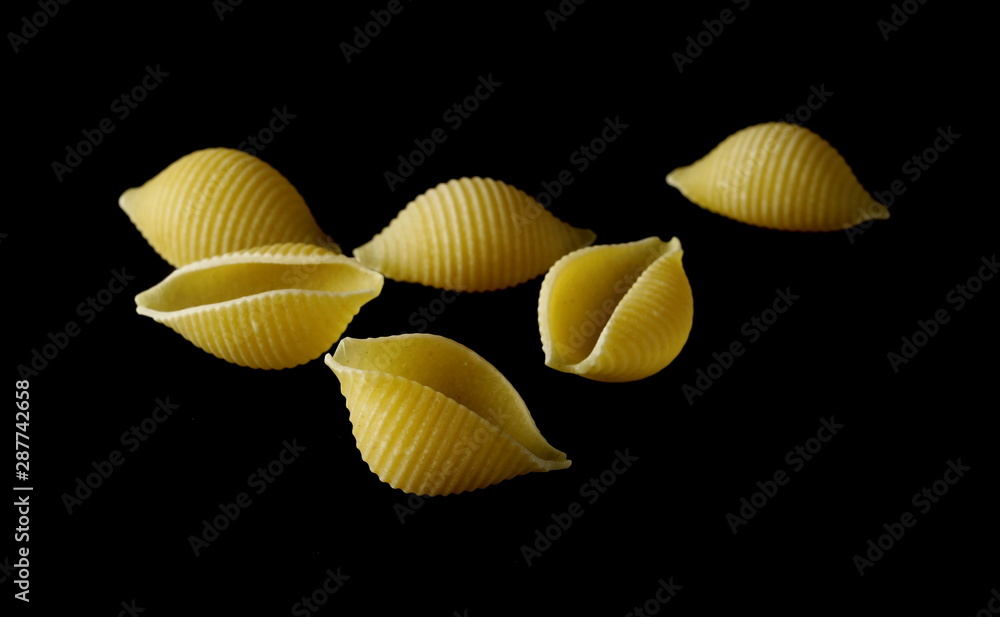 Conchiglie grandi pasta isolated on black background Stock Photo