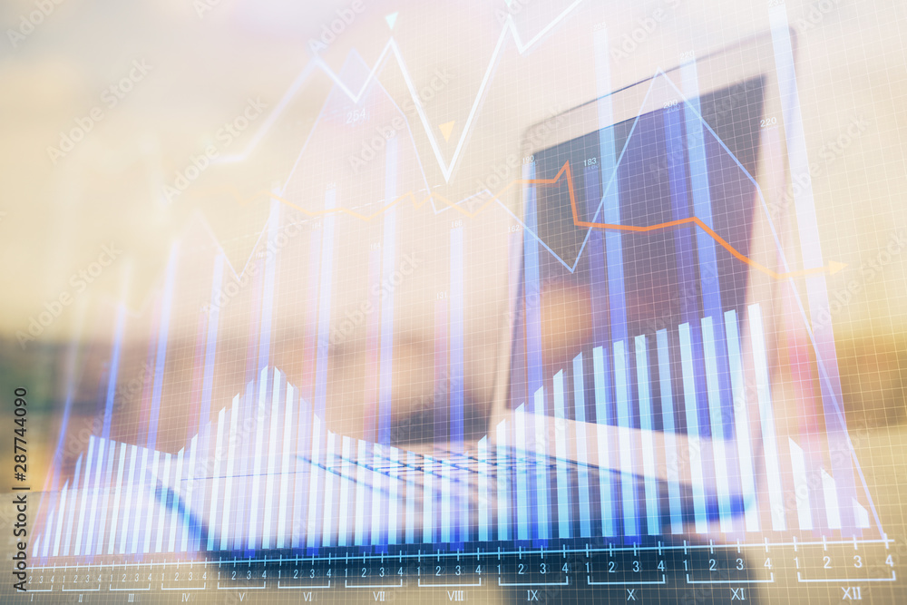 Forex market graph hologram and personal computer on background. Double exposure. Concept of investment. Forex market graph hologram and personal computer on background. Double exposure. Concept of investment.