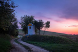 Beautiful purple sunset over christian chapel in Velka Lehota village, Slovakia