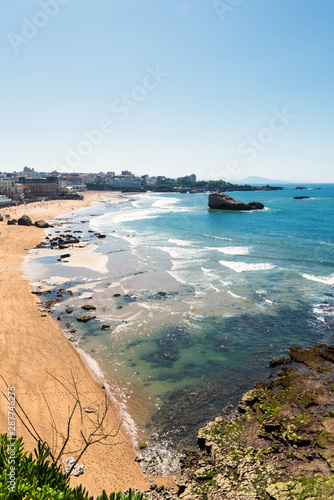 View over the beach in Biarritz at low tide during summer time. Basque coast.