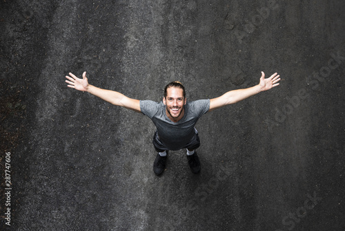 Quadro su tela Top view of man with arms wide open