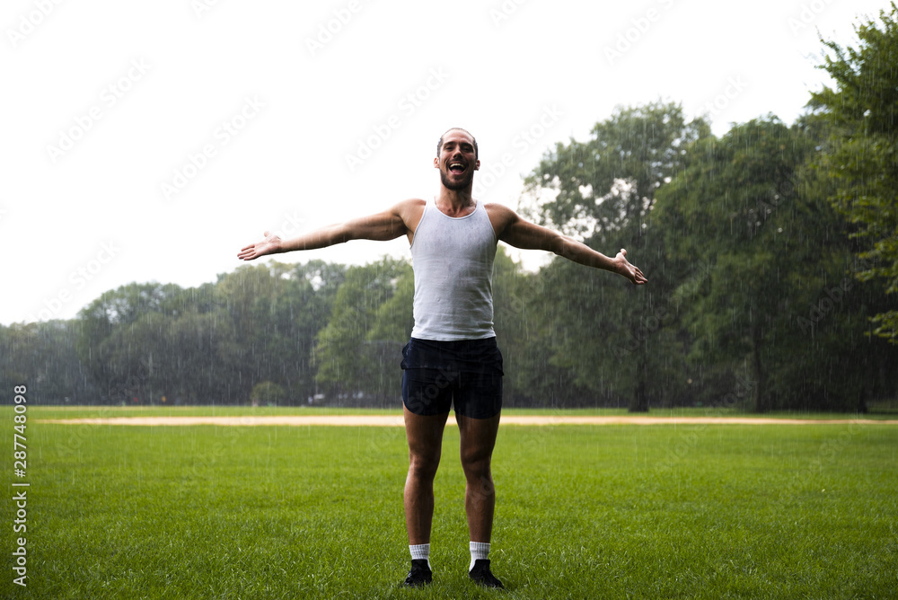 Man in park with arms wide open