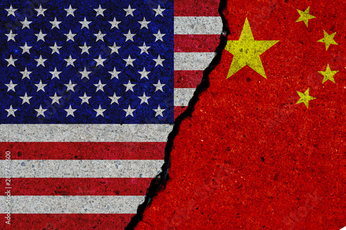 Photography united states and china flags painted over cracked concrete wall