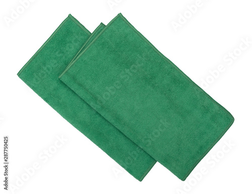 Two folded green microfiber cleaning cloths on a white background photo