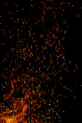 flame of fire with sparks on a black background