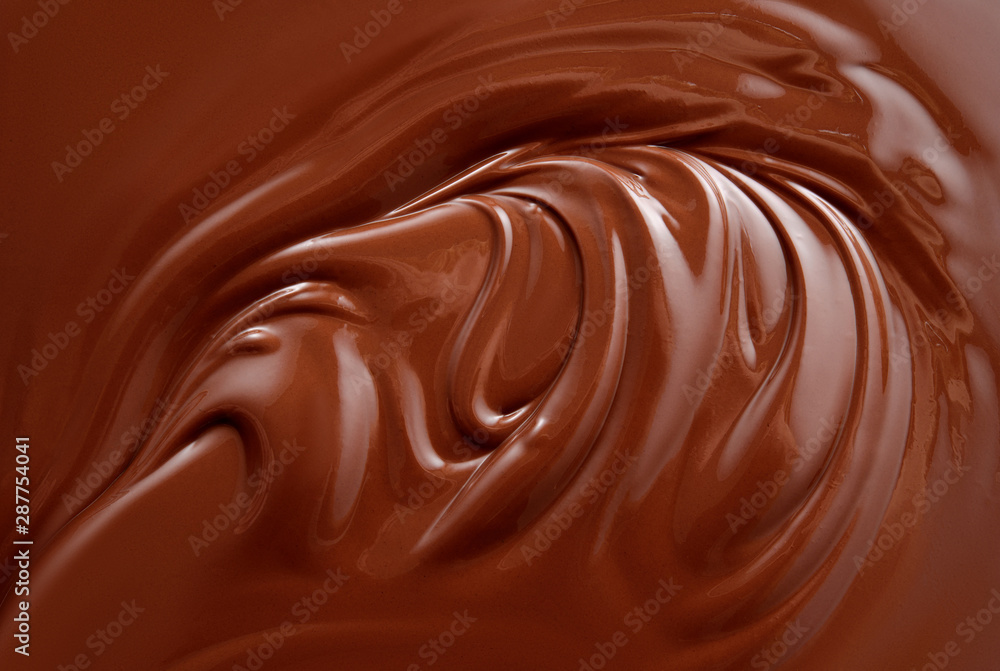 Chocolate background. Melted chocolate surface. Chocolate swirl. Chocolate background. Melted chocolate surface. Chocolate swirl.