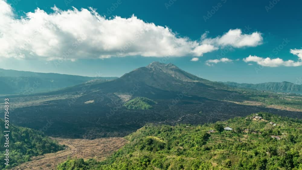 Landscape of Batur volcano and black lava on Bali island, Indonesia. Timelapse 4K Landscape of Batur volcano and black lava on Bali island, Indonesia. Timelapse 4K