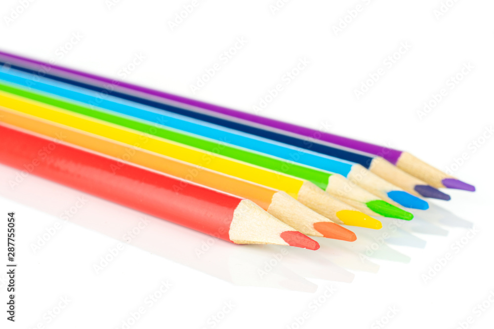 Fototapeta premium Group of seven whole colored pencil rainbow colors isolated on white background