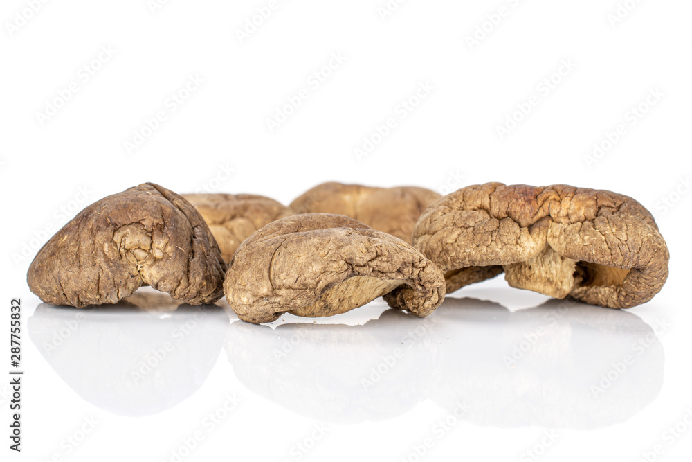 Group of five whole dry mushroom shiitake isolated on white background Group of five whole dry mushroom shiitake isolated on white background