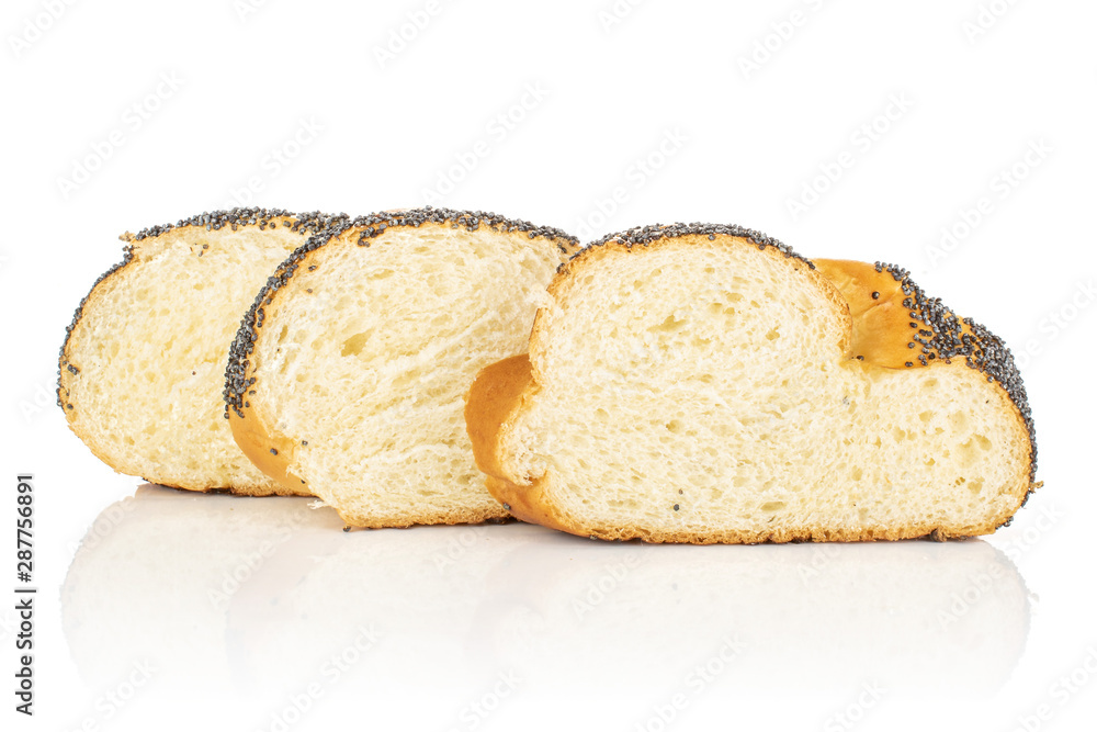 Group of three slices of twisted poppy seed bun in row isolated on white background