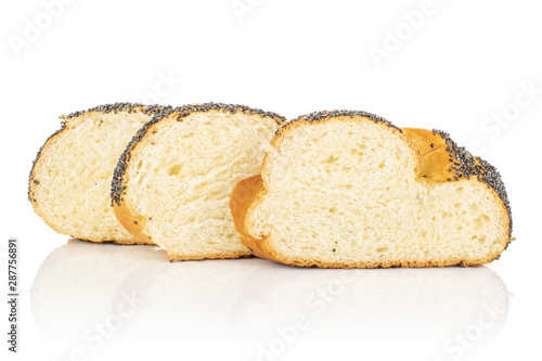 Group of three slices of twisted poppy seed bun in row isolated on white background