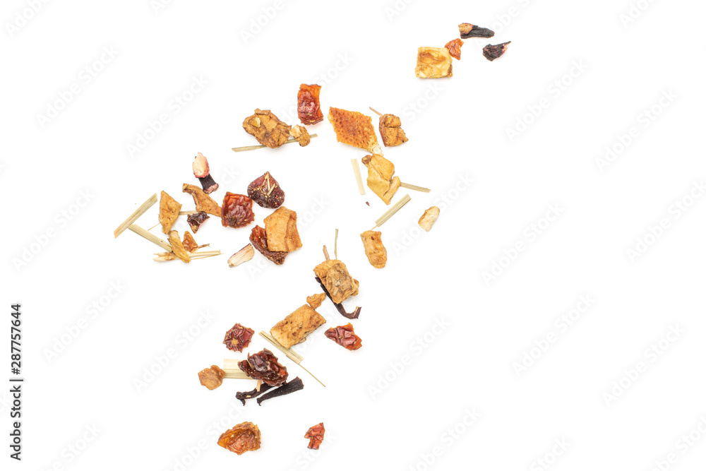 Lot of pieces of lingonberry strawberry fruit tea pieces flatlay isolated on white background Lot of pieces of lingonberry strawberry fruit tea pieces flatlay isolated on white background