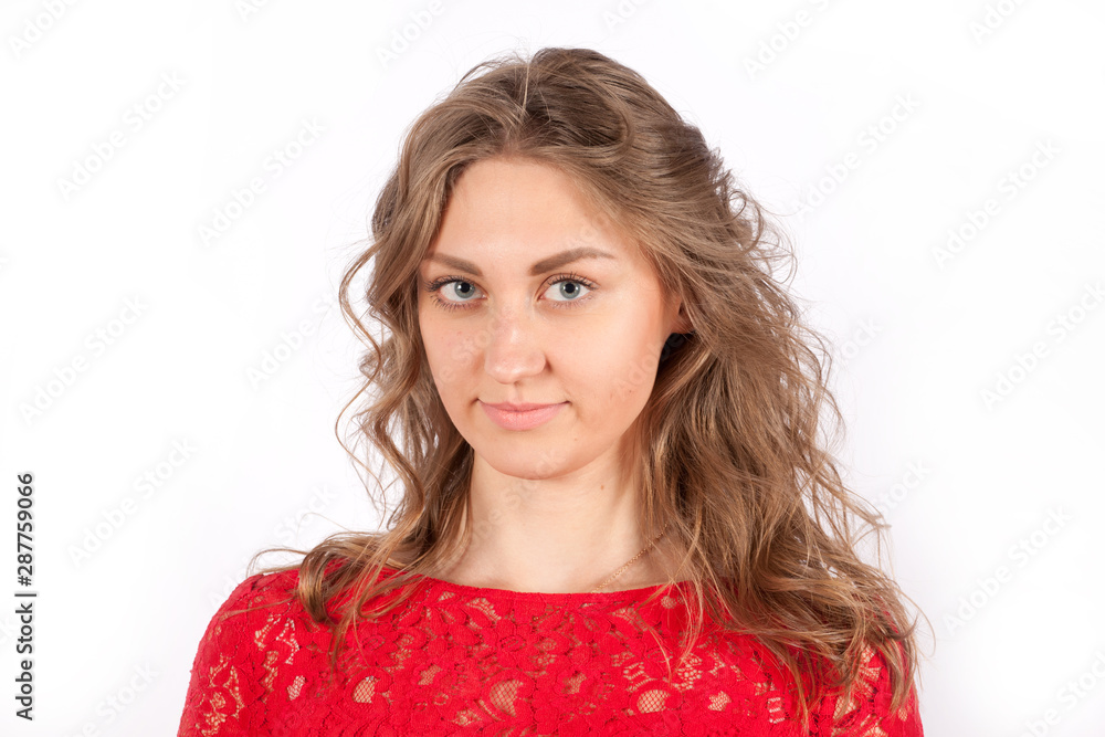 Portrait of a smiling pretty young woman in a red dress Portrait of a smiling pretty young woman in a red dress