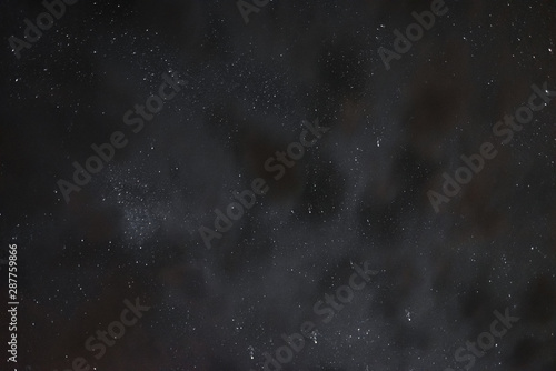 Stars in the night sky through the clouds on a summer night © dmitriydanilov62