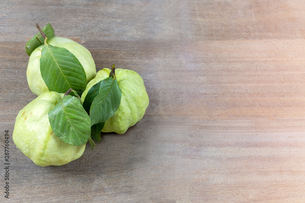 Fresh guava fruit on wood table with copy space for text or design. Fresh guava fruit on wood table with copy space for text or design.