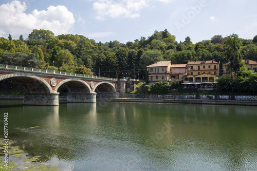 The Isabel bridge over the river Po in Turin, seen from the Valentino park.