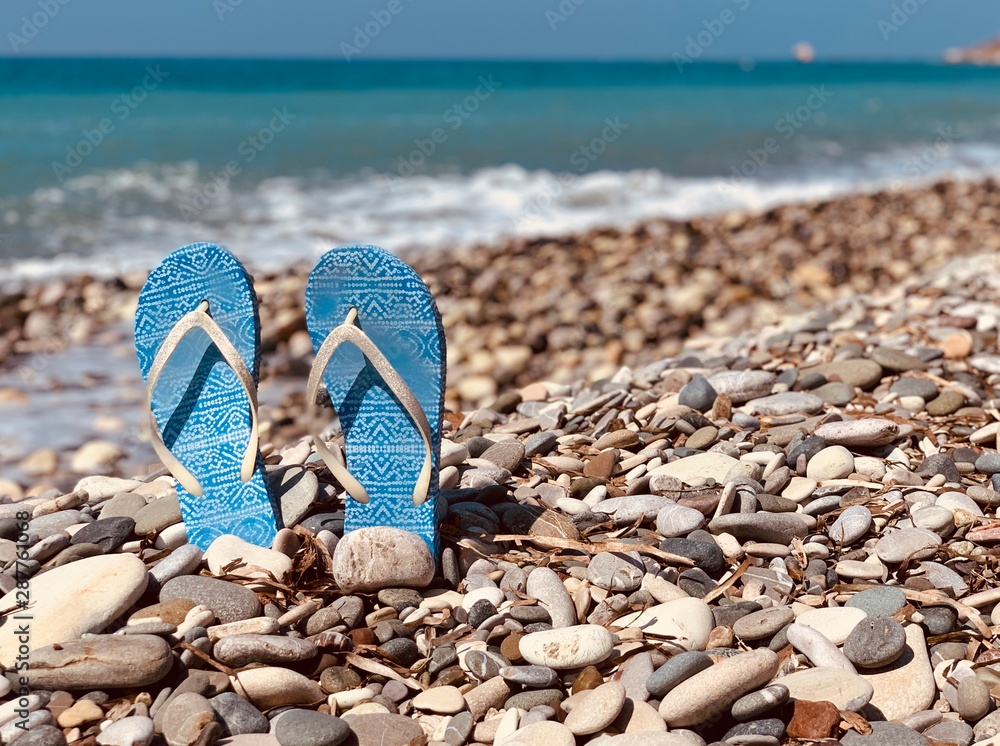 slippers on the beach. copy space slippers on the beach. copy space